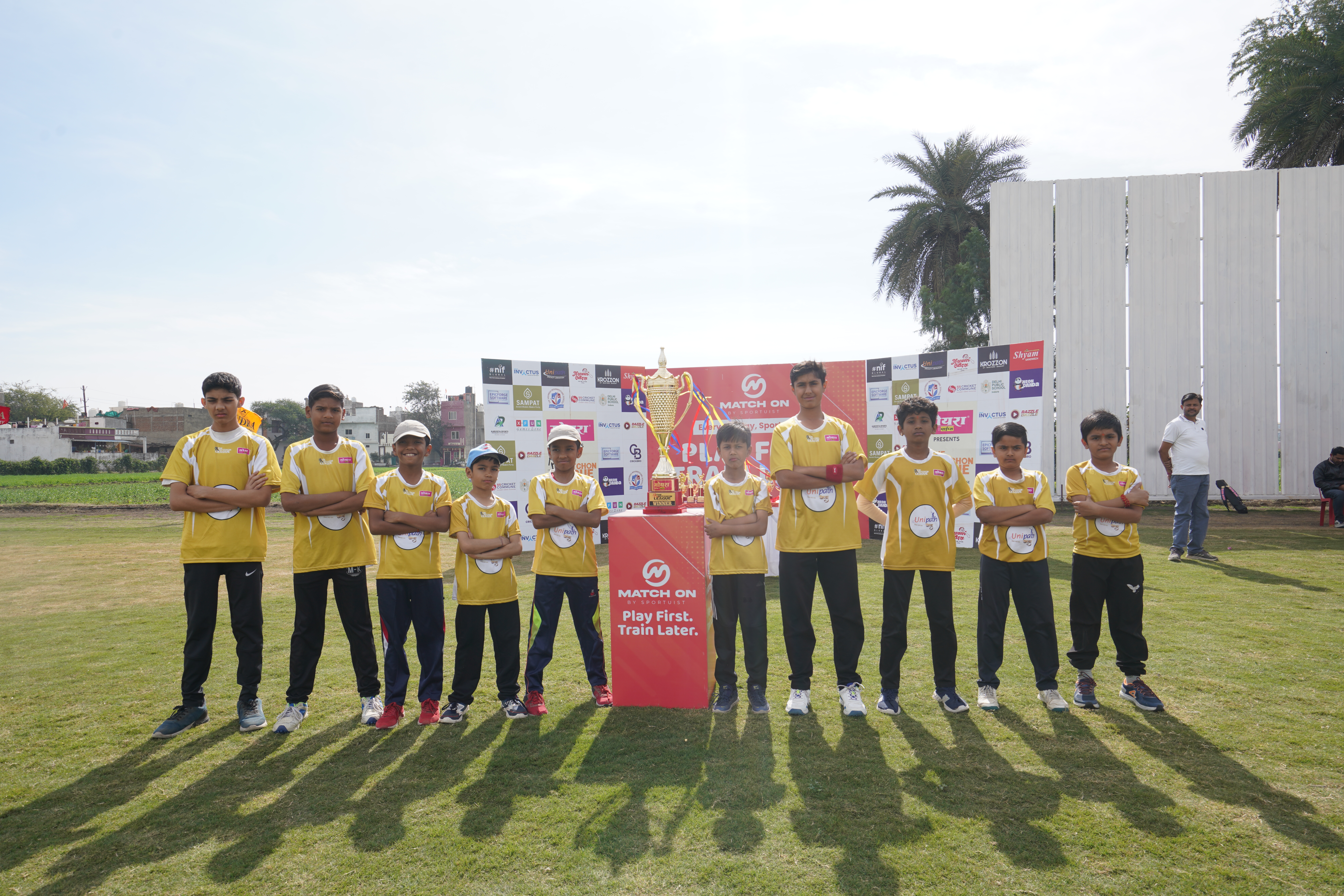 Young cricketers playing together on the ground